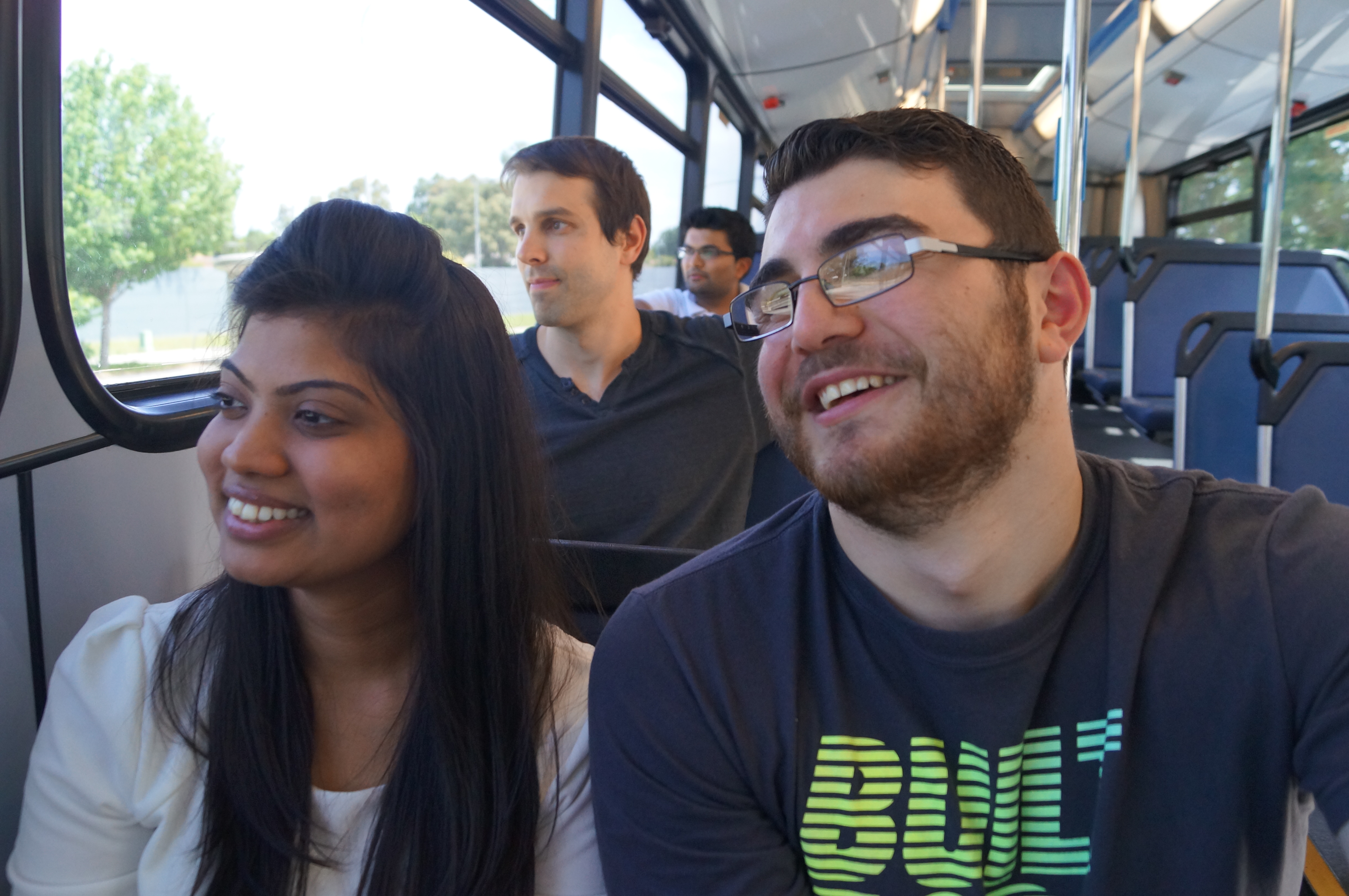 Passengers smiling on bus