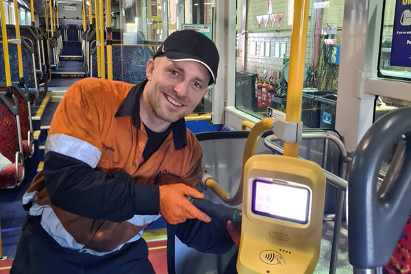 Busways employee show off new validator