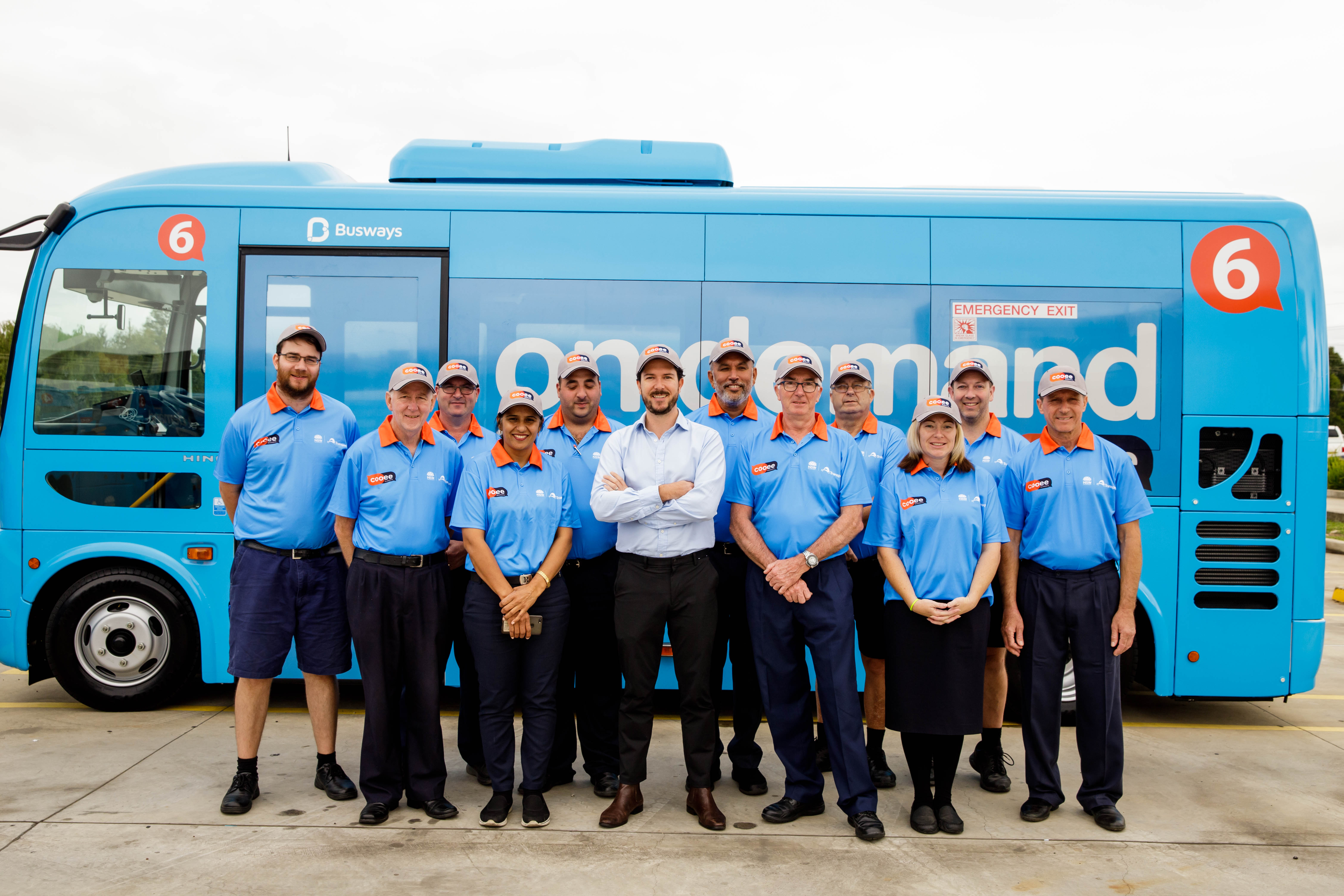 This is a photo of Cooee Busways drivers and Busways' MD.