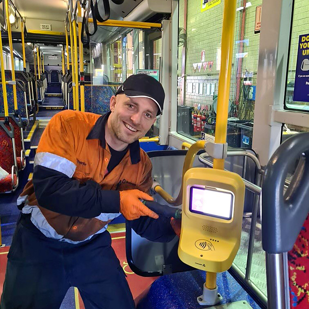 Busways employee shows off new validator