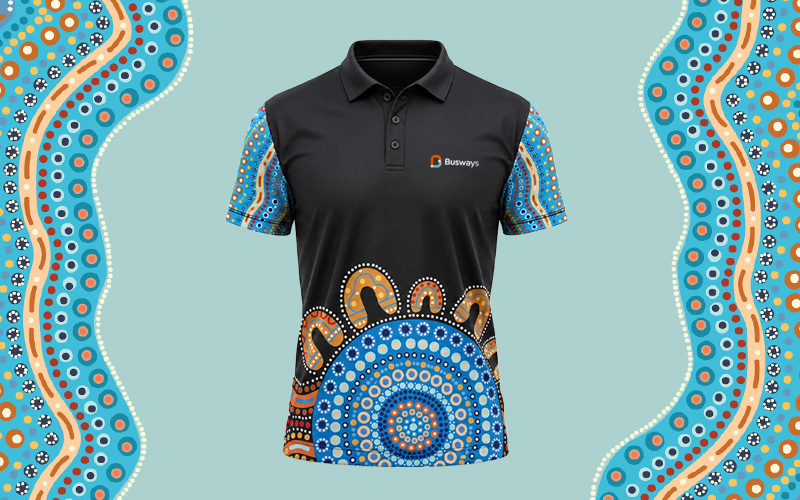 New NAIDOC Week Shirt pictured in front of aboriginal artwork