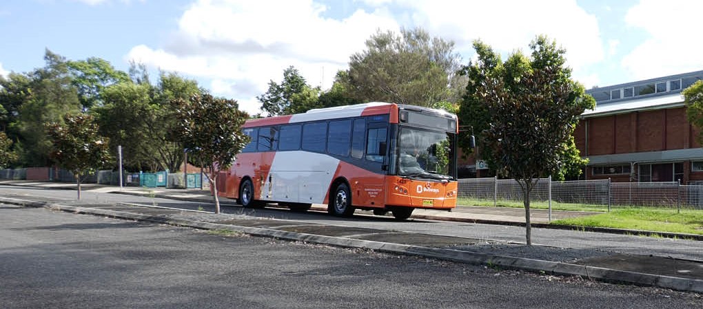 Orange bus on a street