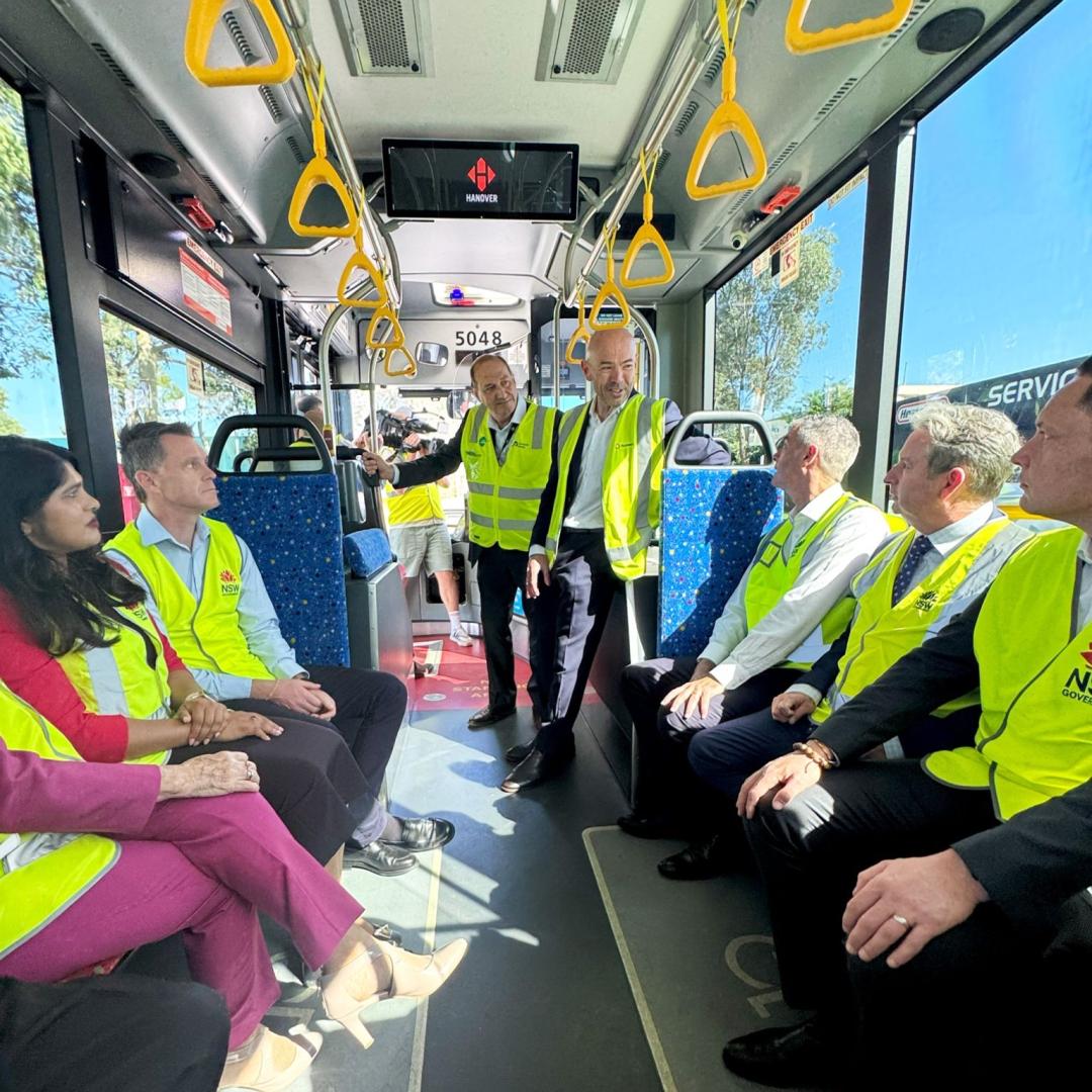 Busways CEO Will O'Neill with NSW Premier Chris Minns and Transport Minister John Graham on one of the new electric buses