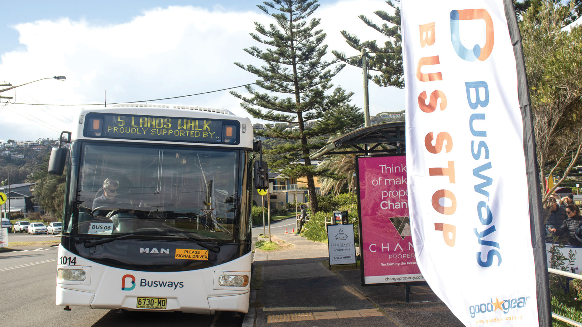 Bus pulling up to kerb for 5 lands walk event