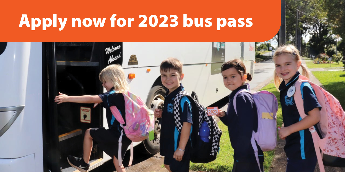 children entering a puss, holding up their bus passes