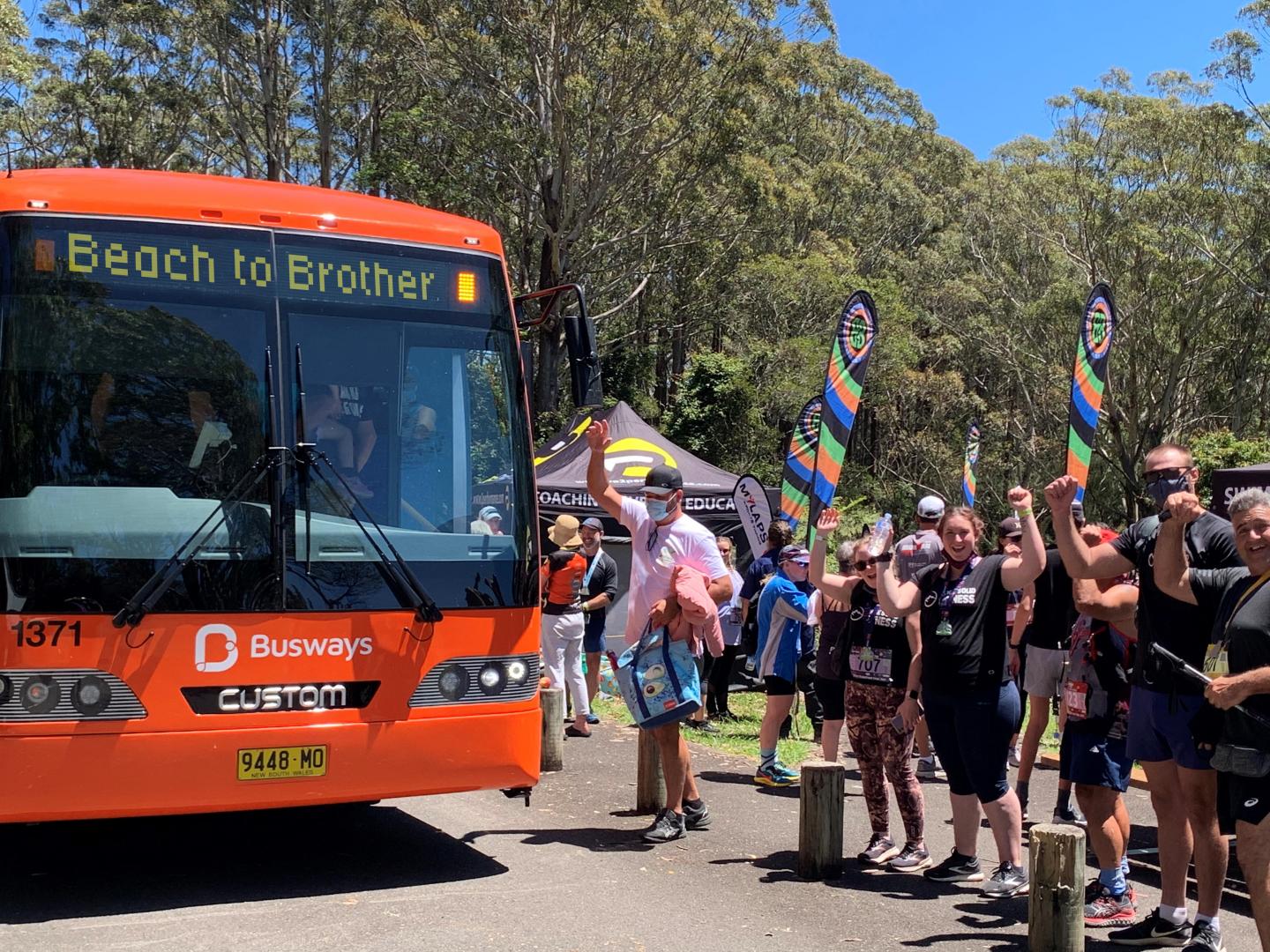 Beach to Brother event attendees getting on free Busways shuttle bus