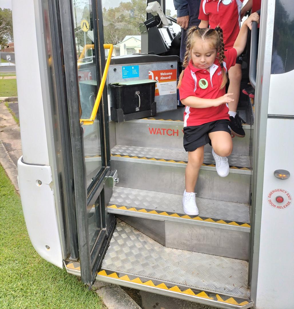 Indy holds on as she gets off the bus