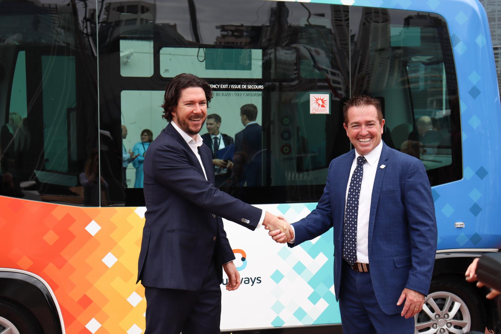Busways Managing Director Byron Rowe with Minister for Regional Roads and Transport Paul Toole.