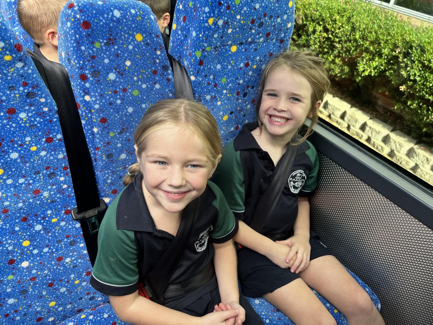 Busways educator Murray White presents St Peters Primary School students with bus safety hero gift packs