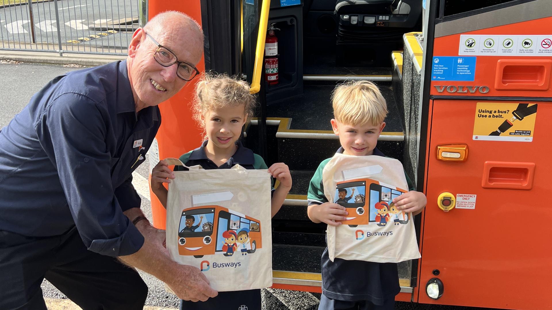 Trainer giving Goodies to kids  