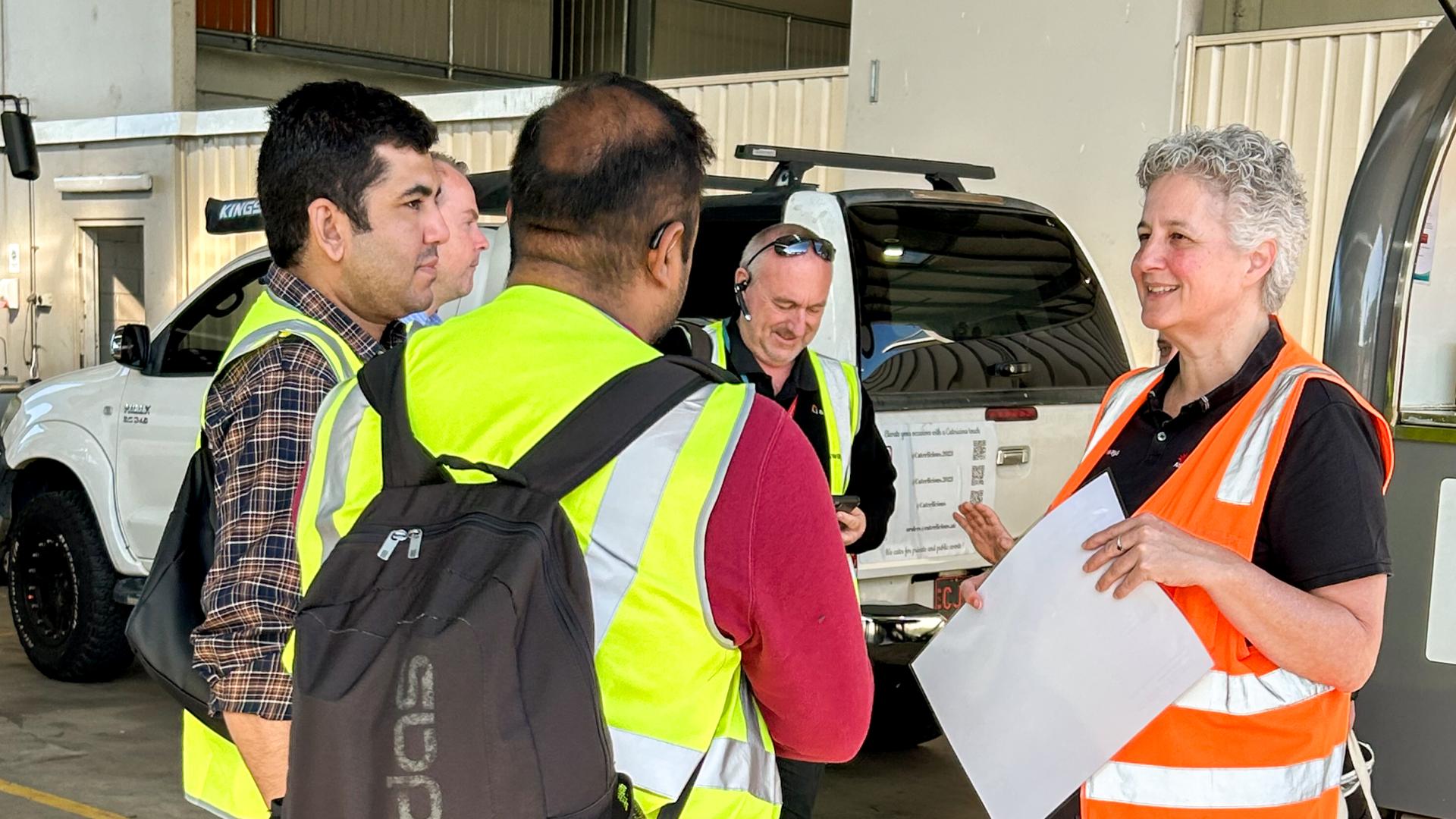 Safety Manager in conversation with team