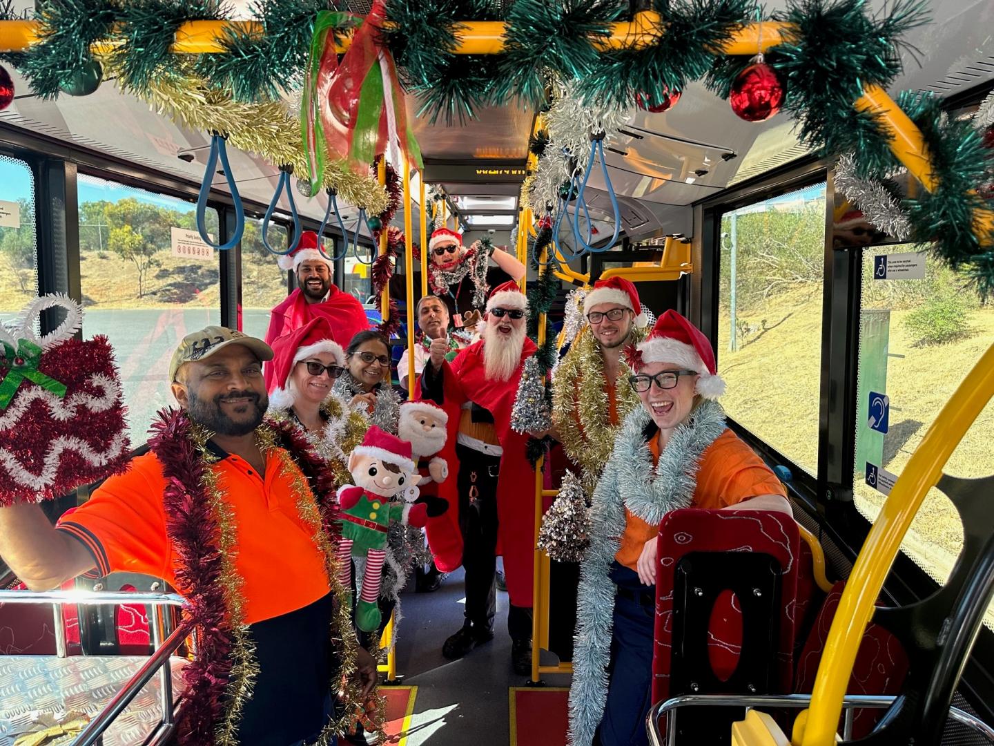 South Australian Busways employee dressed in Christmas costume on a decorated Christmas bus