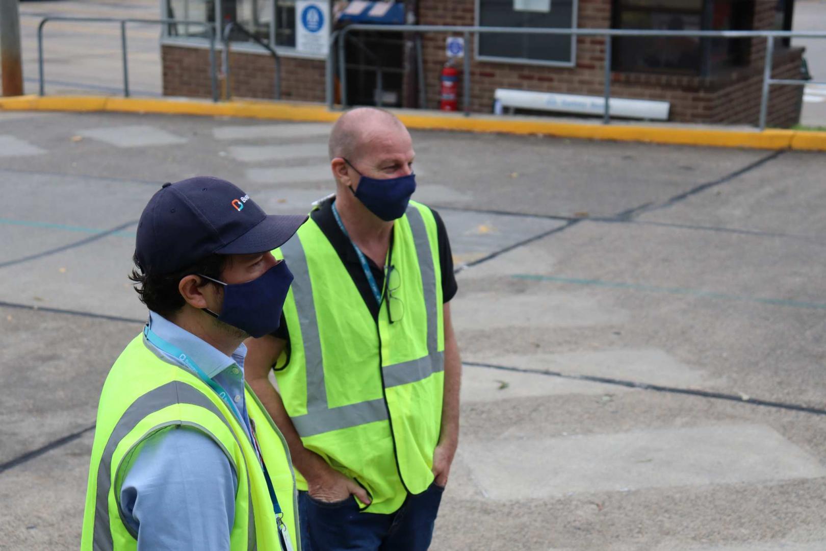Busways Managing Director Byron Rowe (left) and Chief Operating Officer Chris Wolf observe day one of operations
