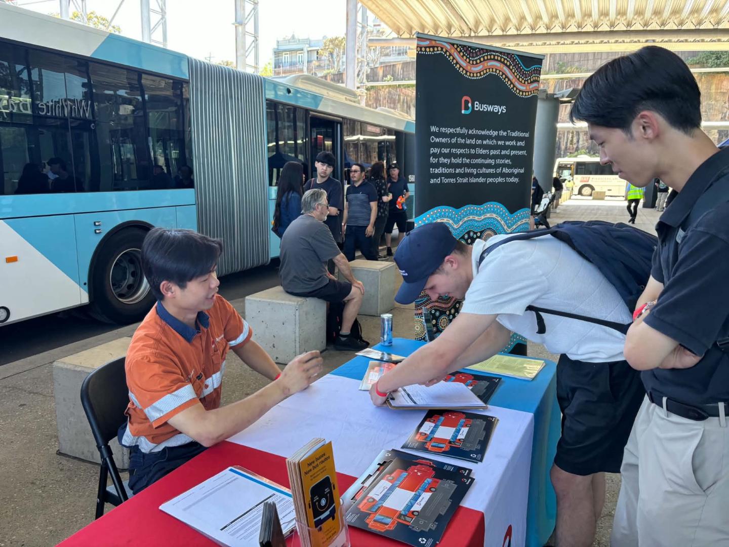 Busways employee answering questions from the public at Busfest 2026