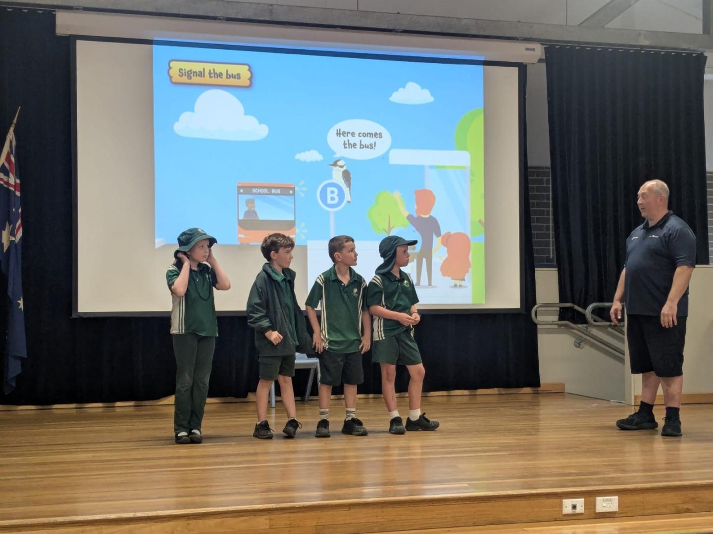 Our bus educator on stage with students during a practical demonstration